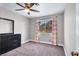 Well-lit bedroom with a dresser and large window at 4726 Beaconsfield St, Las Vegas, NV 89147