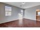 Large bedroom with dark wood-look floors and bathroom access at 6255 W Arby Ave # 295, Las Vegas, NV 89118