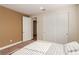 This bedroom offers a comfortable bed and a closet with sliding doors at 6524 Summershade St, North Las Vegas, NV 89086