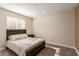 Bedroom with a plush bed, a bedside table, and a window offering natural light at 6524 Summershade St, North Las Vegas, NV 89086