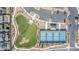 A bird's eye view of a well-maintained fenced dog park and pickle ball courts at 6524 Summershade St, North Las Vegas, NV 89086