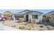 Charming single-story home features desert landscaping, a two-car garage, and a brick driveway at 6524 Summershade St, North Las Vegas, NV 89086