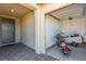 This single car garage features an automatic door, a motorcycle and bicycle parking and brick paved entryway at 6524 Summershade St, North Las Vegas, NV 89086
