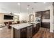 Spacious kitchen featuring modern cabinetry, large island, and stainless steel appliances at 6524 Summershade St, North Las Vegas, NV 89086