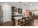 Modern kitchen featuring a center island with bar seating, sleek appliances, and ample counter space at 6524 Summershade St, North Las Vegas, NV 89086