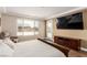 Relax in this main bedroom with a large screen tv and a door to the backyard at 6524 Summershade St, North Las Vegas, NV 89086