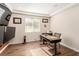 Home office with desk, window and wood floors at 6524 Summershade St, North Las Vegas, NV 89086