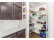 Pantry area in the kitchen with white shelving and ample storage space at 6524 Summershade St, North Las Vegas, NV 89086