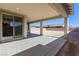 Covered patio features recessed lighting, concrete flooring and a view of a large undeveloped backyard at 6524 Summershade St, North Las Vegas, NV 89086
