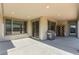 This covered patio features recessed lighting, large sliding doors and a grill for outdoor cooking at 6524 Summershade St, North Las Vegas, NV 89086