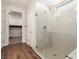 This walk in shower features tiled walls and floors and glass door at 6524 Summershade St, North Las Vegas, NV 89086
