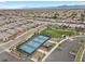 Aerial view featuring community tennis courts, manicured landscaping, and residences in the background at 6524 Summershade St, North Las Vegas, NV 89086