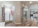 Clean bathroom with a shower, toilet and mirrored closet at 6916 Snow Finch St, North Las Vegas, NV 89084
