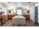 Elegant bathroom with a large soaking tub and dual vanities at 6916 Snow Finch St, North Las Vegas, NV 89084