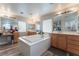 Spa-like bathroom with a soaking tub and double vanities at 6916 Snow Finch St, North Las Vegas, NV 89084