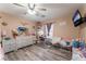 Bedroom with light gray dresser and ceiling fan at 6916 Snow Finch St, North Las Vegas, NV 89084