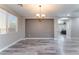 Bright dining room with wood-look floors and chandelier at 6916 Snow Finch St, North Las Vegas, NV 89084