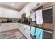 Modern kitchen with stainless steel appliances and white cabinets at 6916 Snow Finch St, North Las Vegas, NV 89084
