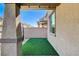 Private backyard with artificial turf and block wall at 710 Bamboo Bend Pl, Henderson, NV 89011
