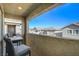 Private balcony with table and chairs, offering neighborhood views at 710 Bamboo Bend Pl, Henderson, NV 89011