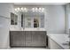 Elegant bathroom with double vanity, large mirror, and soaking tub at 710 Bamboo Bend Pl, Henderson, NV 89011