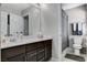 Clean bathroom with a toilet, shower, and vanity with dark brown cabinets at 710 Bamboo Bend Pl, Henderson, NV 89011