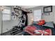 Bright bedroom with a queen-size bed, exercise equipment, and sports memorabilia at 710 Bamboo Bend Pl, Henderson, NV 89011