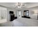 Serene bedroom with ensuite bathroom, dresser, and ceiling fan at 710 Bamboo Bend Pl, Henderson, NV 89011