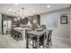 Spacious kitchen and dining area with an island and modern cabinetry at 710 Bamboo Bend Pl, Henderson, NV 89011