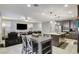 Open floor plan combining kitchen, Gathering room, and dining areas at 710 Bamboo Bend Pl, Henderson, NV 89011