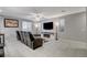 Living room with black reclining furniture and a modern fireplace at 710 Bamboo Bend Pl, Henderson, NV 89011