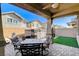 Covered patio with seating area and hot tub at 710 Bamboo Bend Pl, Henderson, NV 89011