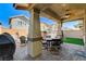 Covered patio with seating area, grill, and artificial turf at 710 Bamboo Bend Pl, Henderson, NV 89011