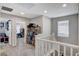 Upstairs hallway with access to bedrooms and storage at 710 Bamboo Bend Pl, Henderson, NV 89011