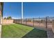 Artificial turf backyard with a metal fence at 7206 Liberty Landing St, Las Vegas, NV 89166