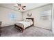 Cozy bedroom with carpeted floor and ceiling fan at 7206 Liberty Landing St, Las Vegas, NV 89166