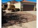 One-story house with tile roof, two-car garage, and desert landscaping at 752 Salt Flats Cir, Henderson, NV 89011