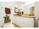 Clean bathroom with granite countertop and white cabinets at 7943 Harbour Towne Ave, Las Vegas, NV 89113