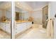 Elegant bathroom with double vanity, soaking tub, and shower at 7943 Harbour Towne Ave, Las Vegas, NV 89113