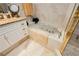 Relaxing bathroom with a jetted tub and granite vanity at 7943 Harbour Towne Ave, Las Vegas, NV 89113