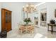 Charming breakfast nook with glass table and chandelier at 7943 Harbour Towne Ave, Las Vegas, NV 89113