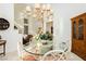 Breakfast nook features a glass-top table and built-in hutch at 7943 Harbour Towne Ave, Las Vegas, NV 89113