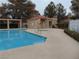 Serene community pool area with a clear blue pool and convenient restroom facilities for residents at 7943 Harbour Towne Ave, Las Vegas, NV 89113