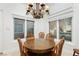 Charming wood dining table with seating for four in the kitchen at 7943 Harbour Towne Ave, Las Vegas, NV 89113