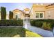 House entrance with a white gate and well-manicured hedges at 7943 Harbour Towne Ave, Las Vegas, NV 89113