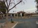Attractive building entrance with circular drive, desert landscaping, and covered entryway at 7943 Harbour Towne Ave, Las Vegas, NV 89113