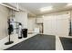 Spacious garage interior with storage cabinets and essential equipment, providing ample space and organization at 7943 Harbour Towne Ave, Las Vegas, NV 89113