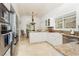 Bright kitchen with stainless steel appliances and white cabinets at 7943 Harbour Towne Ave, Las Vegas, NV 89113