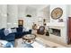 Living room with fireplace and comfortable seating at 7943 Harbour Towne Ave, Las Vegas, NV 89113