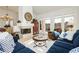Bright living room featuring comfortable seating and a fireplace at 7943 Harbour Towne Ave, Las Vegas, NV 89113